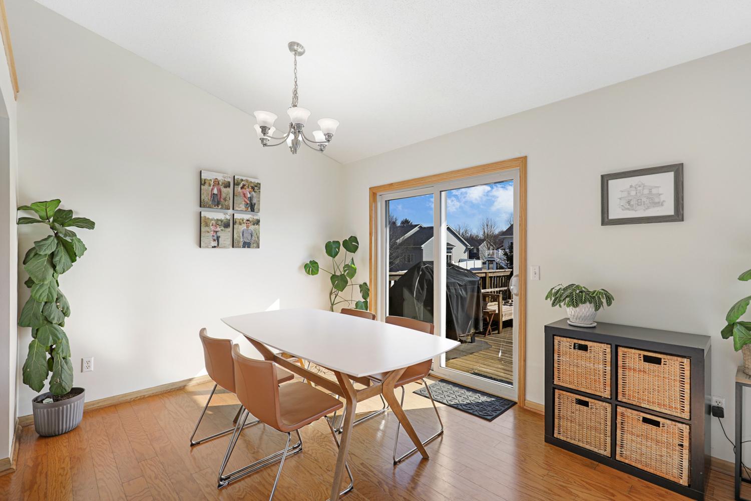 Dining area open to living, looking out to the NEXT LEVEL back yard.
