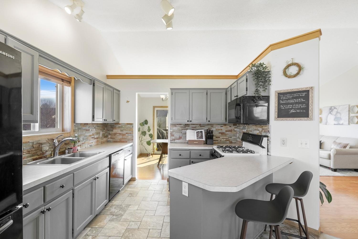 Updated cabinets, open to the eat in kitchen.