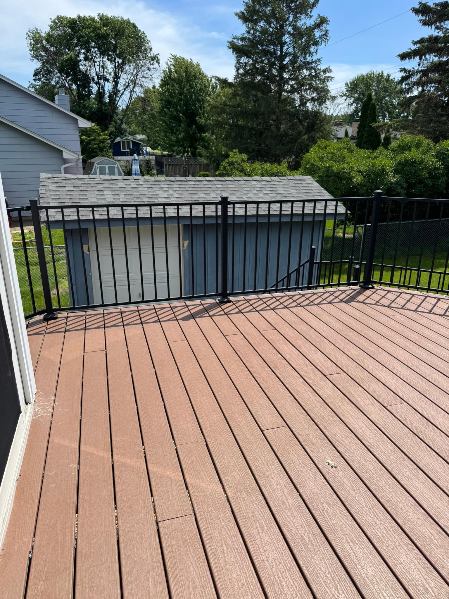 Maintenance free deck overlooks private back yard