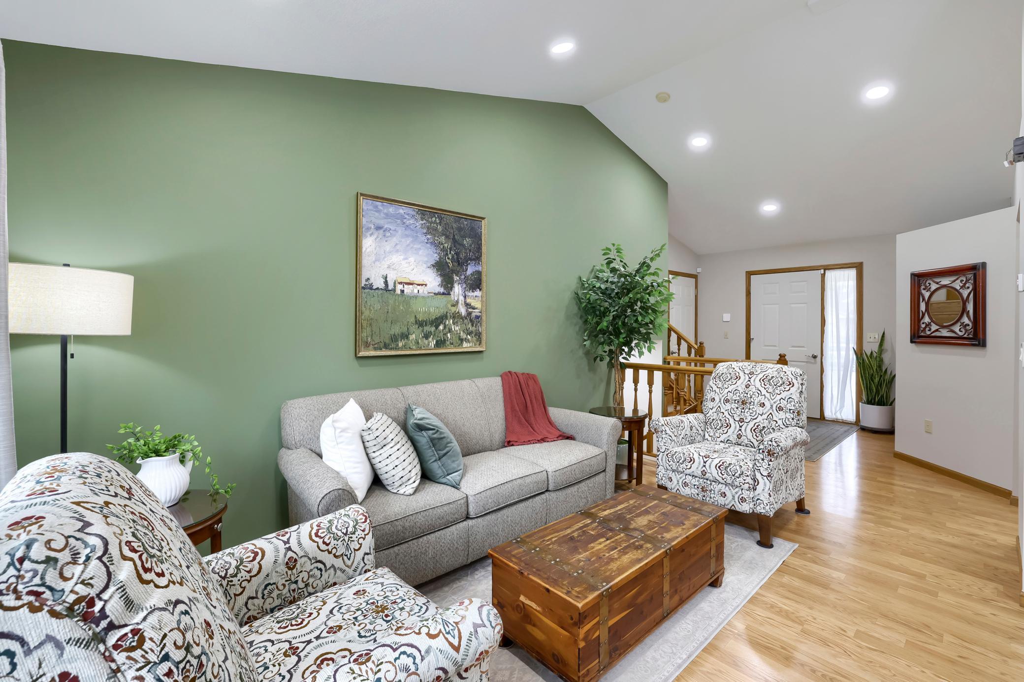 Enjoy the comfortable living room with the laminate flooring