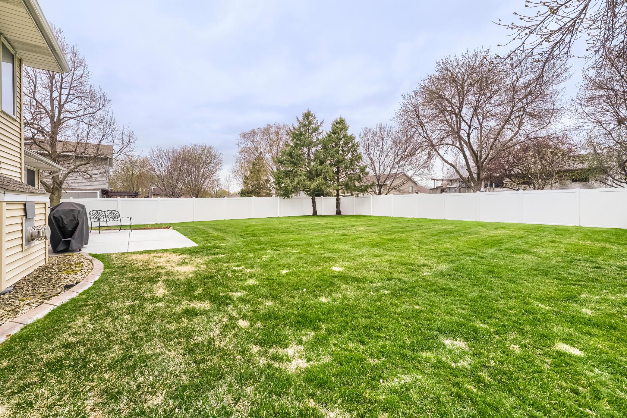 The good sized yard is completely enclosed with a privacy fence