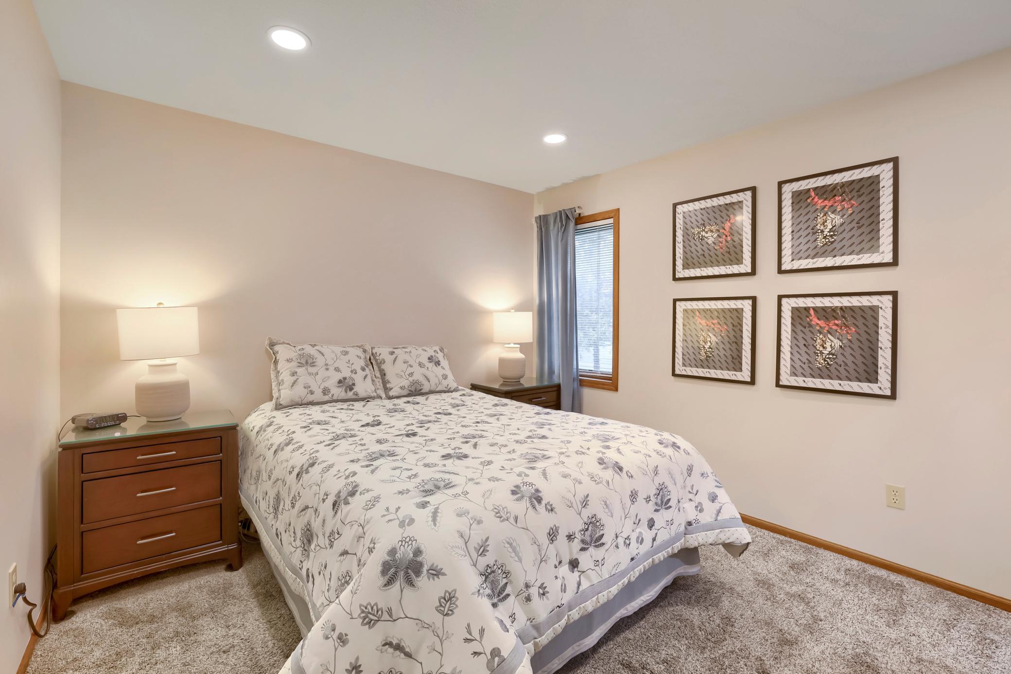 The primary bedroom on the upper level looks out over the backyard