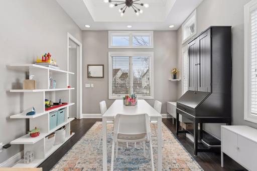Versatile dining or flex space with large windows, high ceilings, and plenty of room for gathering or creative use. Ideal as a dining room, playroom, or home office
