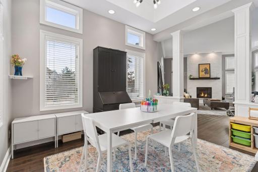Versatile dining or flex space with large windows, high ceilings, and plenty of room for gathering or creative use. Ideal as a dining room, playroom, or home office