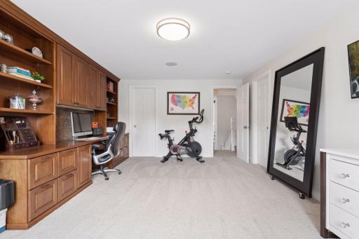 This fourth bedroom is currently being used as office, light work-out, flex space. Two large closets(one of which abuts the powder room) invite easy conversion to another bedroom suite.
