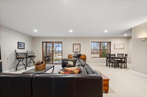 Heading downstairs, you'll immediately notice the patio door and windows with views of the backyard.