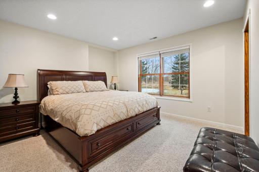 The fourth bedroom has a walk-in closet and views of the backyard.