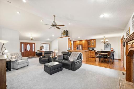 The living room flows seamlessly into the dining room and kitchen.