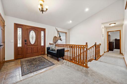 The entry way is bright and open with vaulted ceilings.