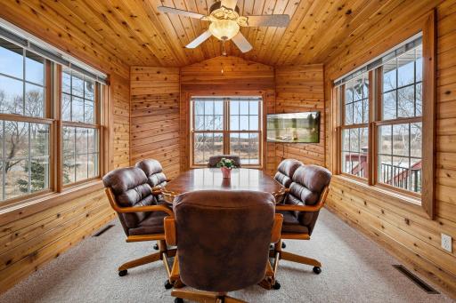 The 4-season porch is flanked in wood and feels as if you're up north at a cabin!