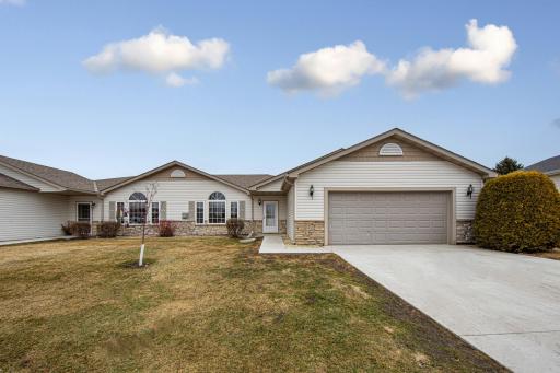 Front with newer cement driveway and sidewalk