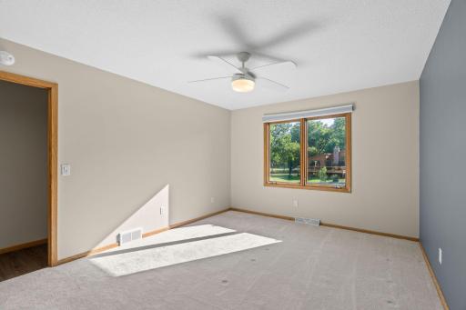 Generously sized primary bedroom with an ensuite bathroom and shower offers a private retreat