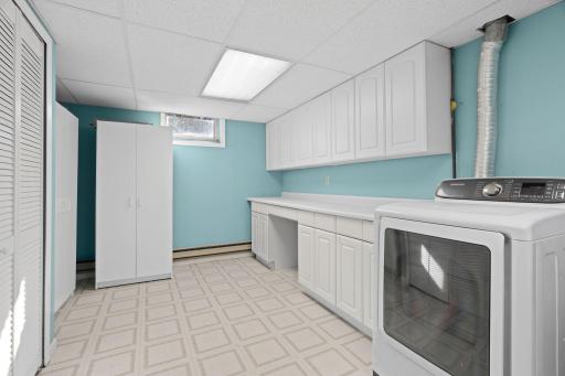 Spacious laundry room with extra storage helps keep life organized