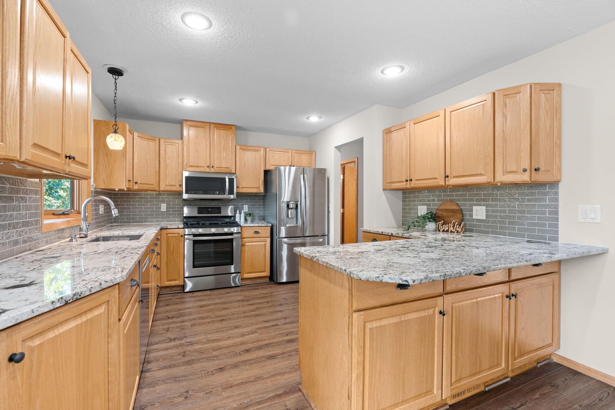 The kitchen was updated in 2018 to include the flooring, granite countertops and new appliances