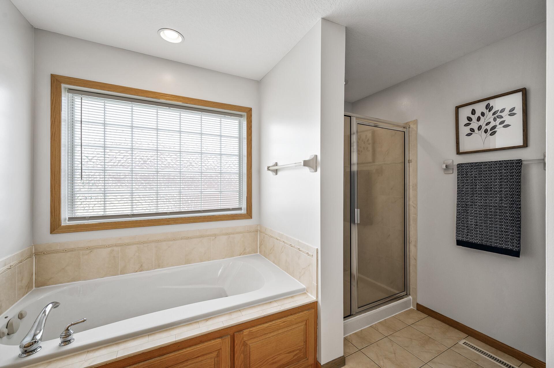 A place to unwind in a soaker tub or walk in shower, time to relax.