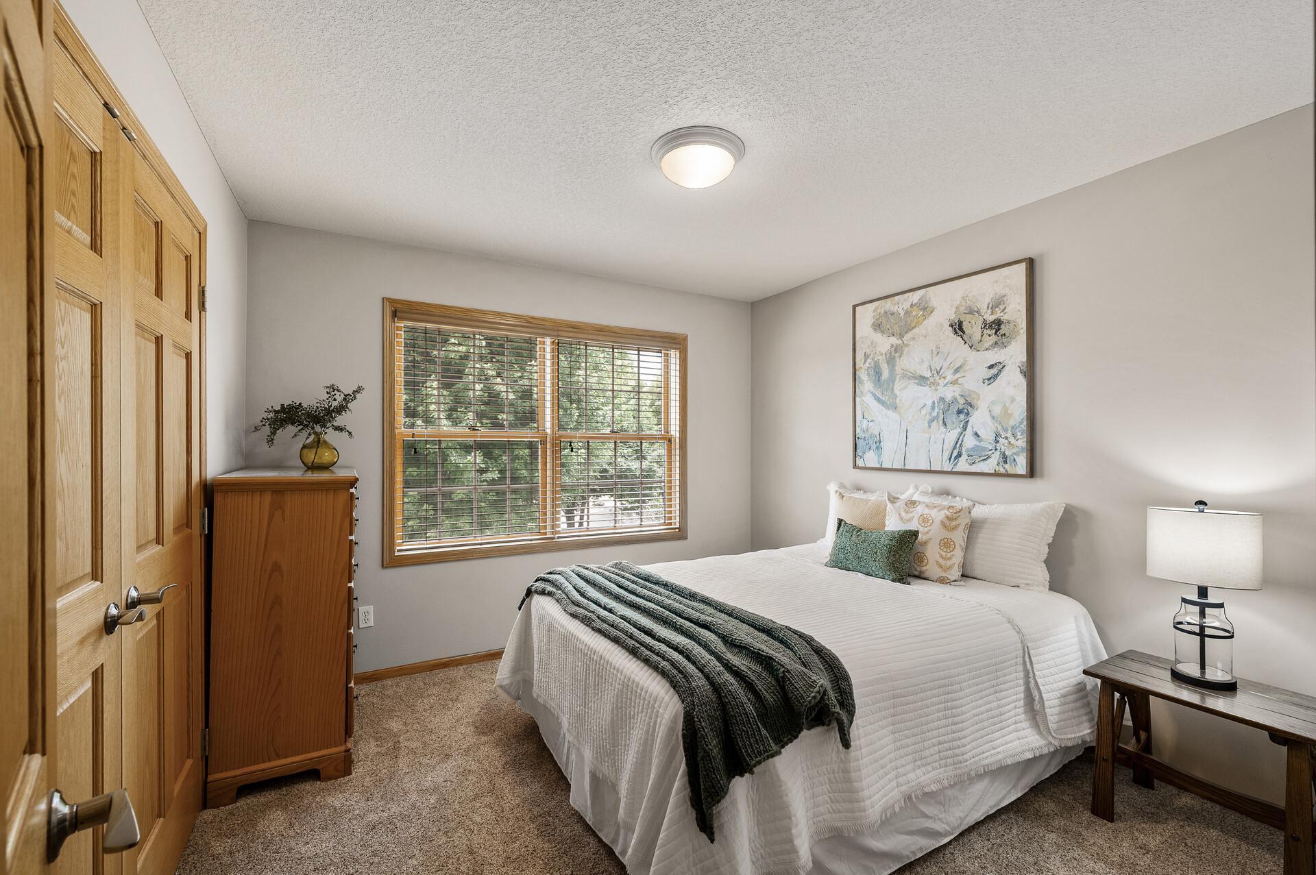 3rd spacious bedroom on the upper level, cozy and comfortable for a good nights sleep.