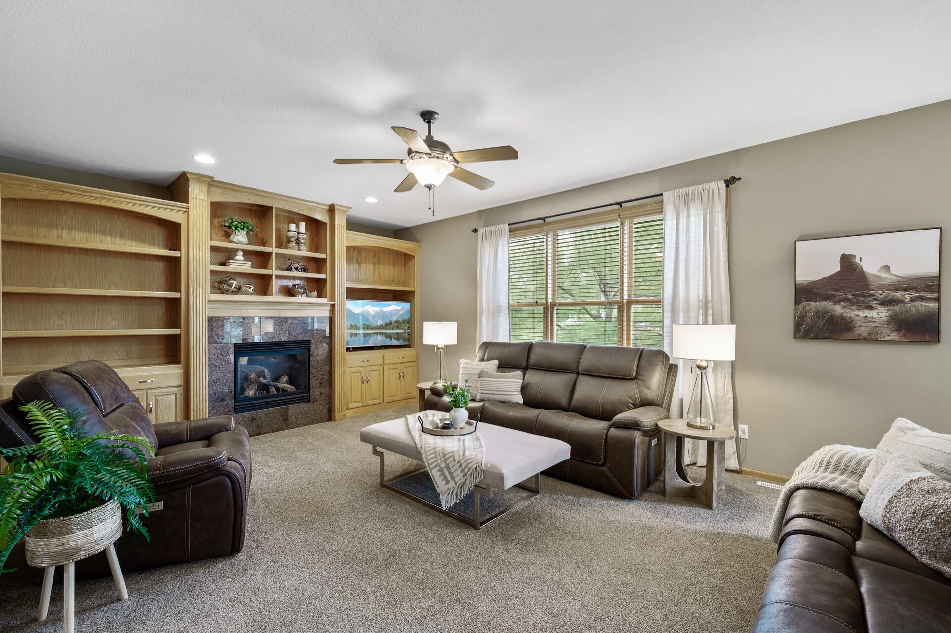 A cozy focal point and timeless charm—this living room’s fireplace sets the scene for warm nights.