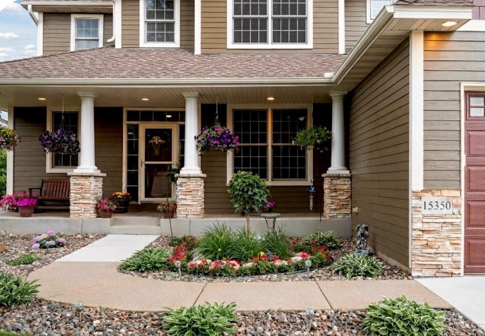 Stepping up to a spacious porch that invites you to slow down, relax, and feel right at home.