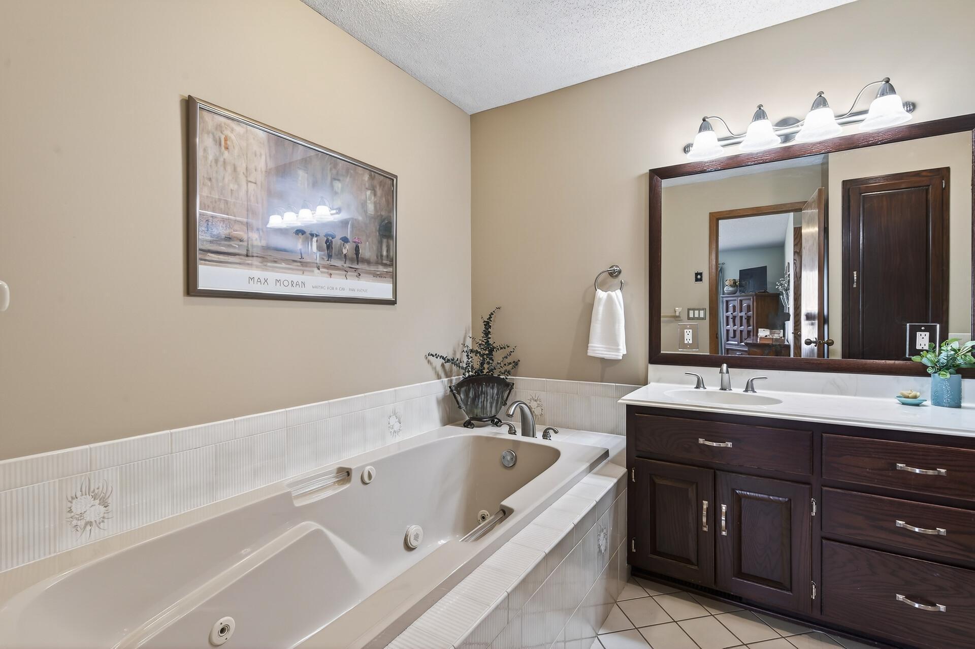 Large soaking tub ready for slow mornings or long days