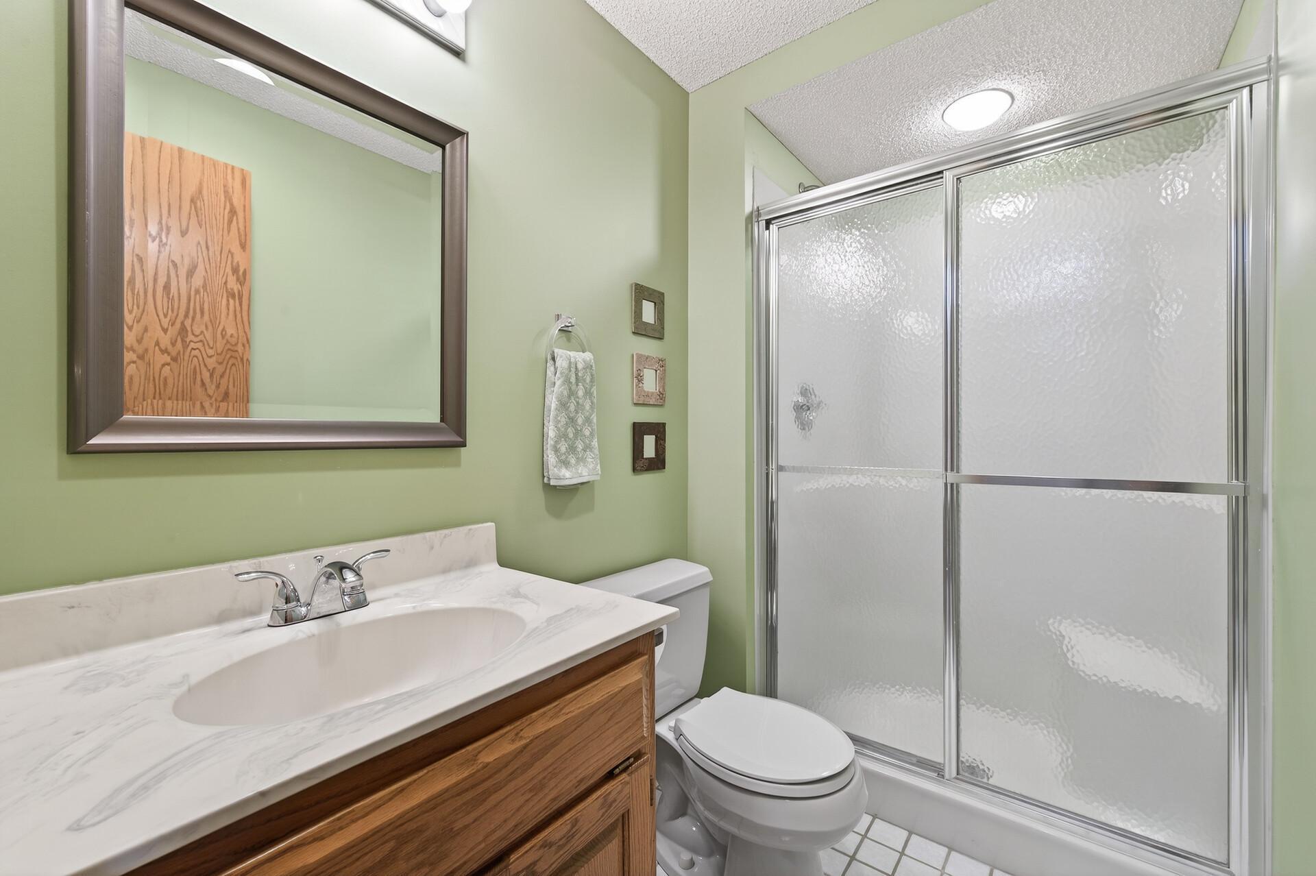 Clean, well-maintained bath with walk-in shower