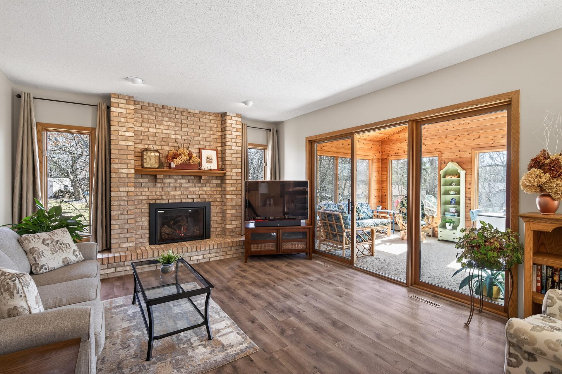 Warm and inviting living area anchored by a cozy fireplace