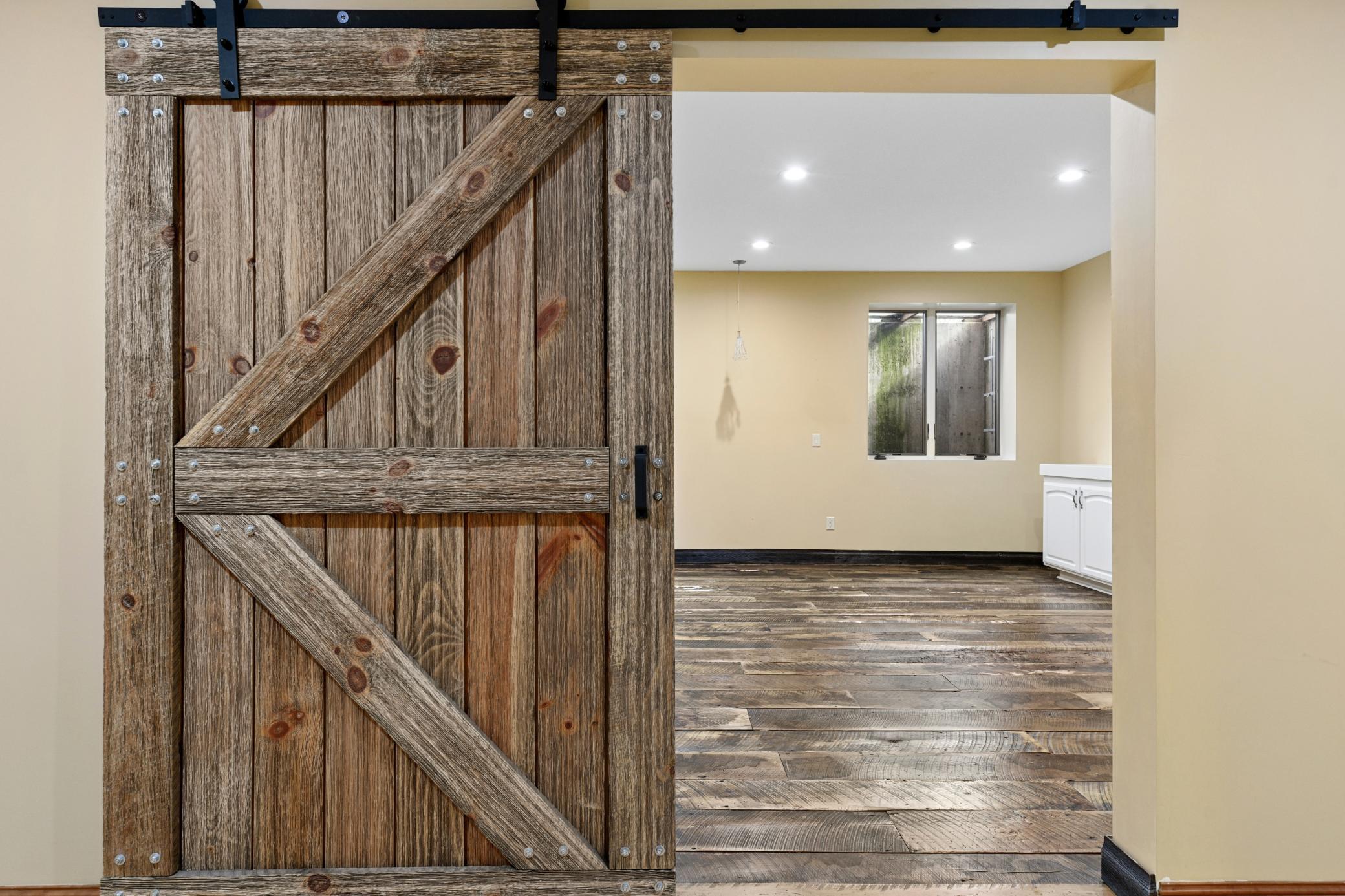 The sixth bedroom is just on the other side of this barn door