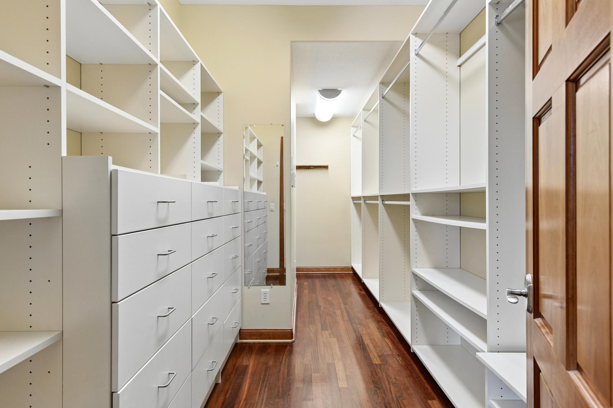 Custom built primary walk-in closet