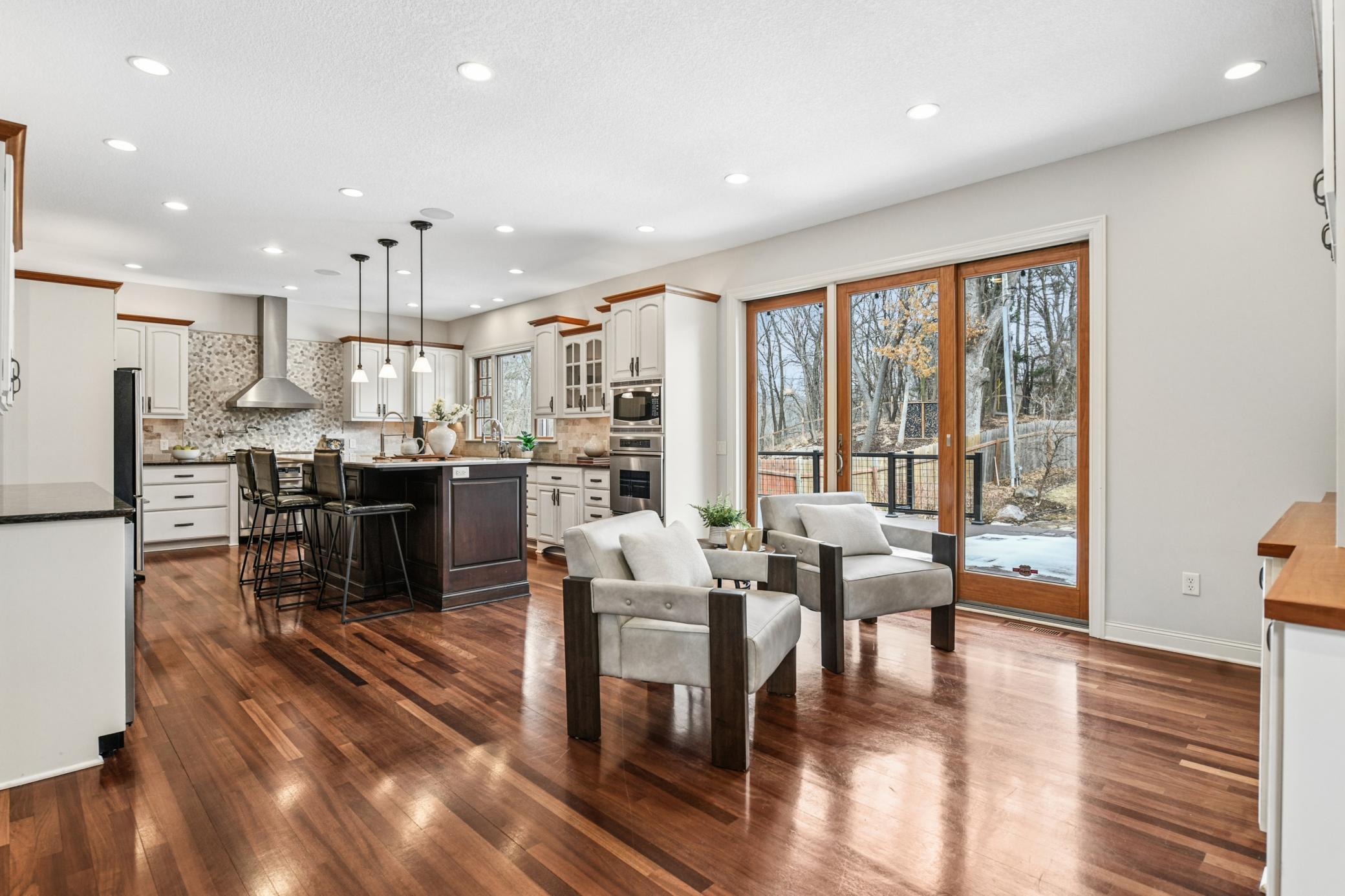 Head to the expansive kitchen area with easy access to the large maintenance free deck in the backyard