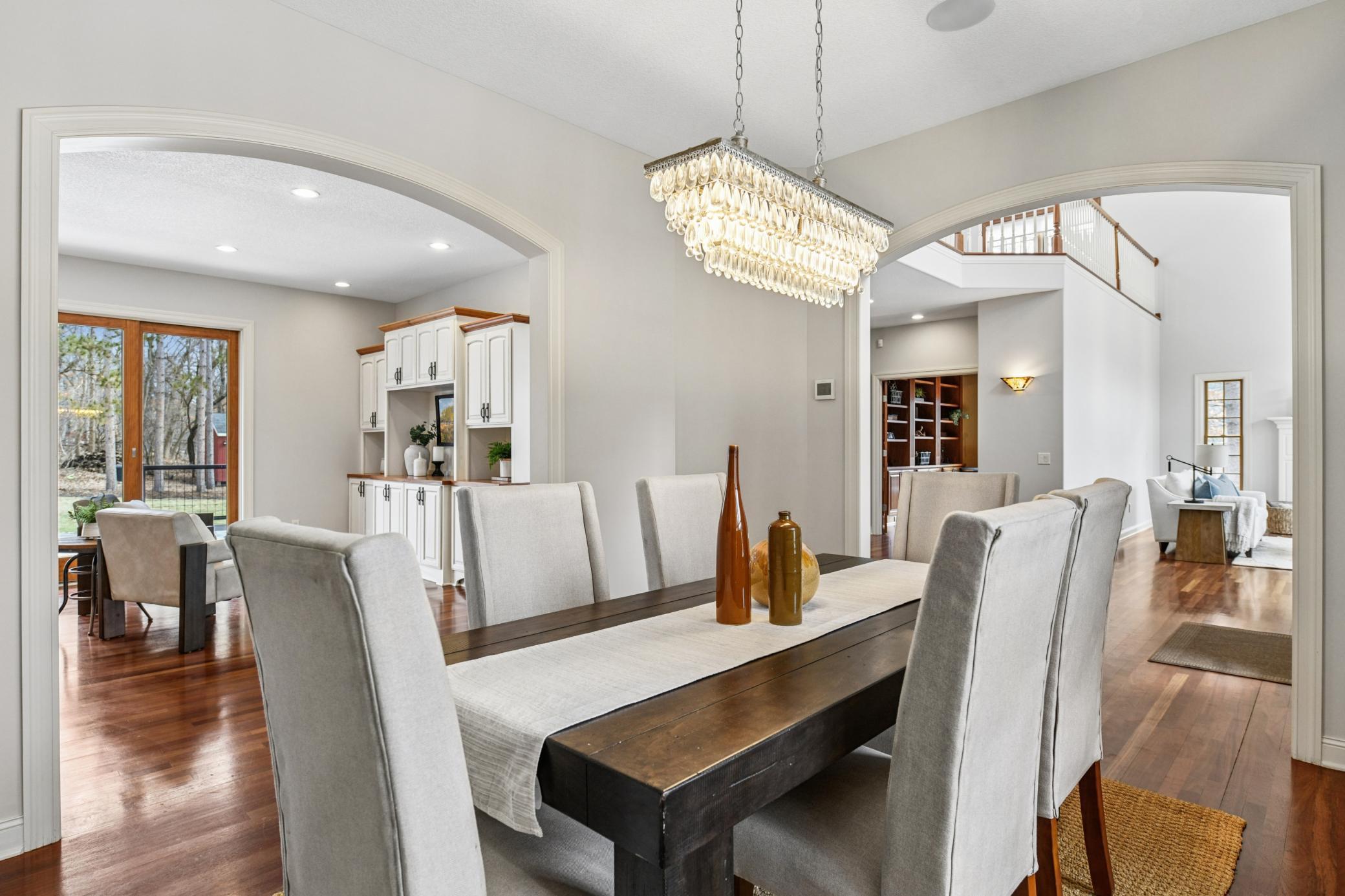 Lovely architectural character with arched entryways leading to a formal dining room