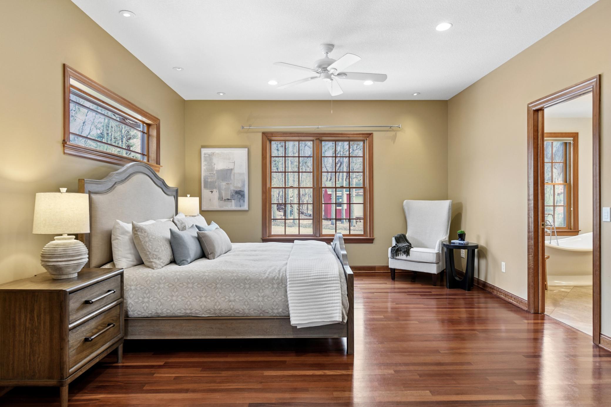 Main floor primary ensuite with eastern views and separate access to the back deck