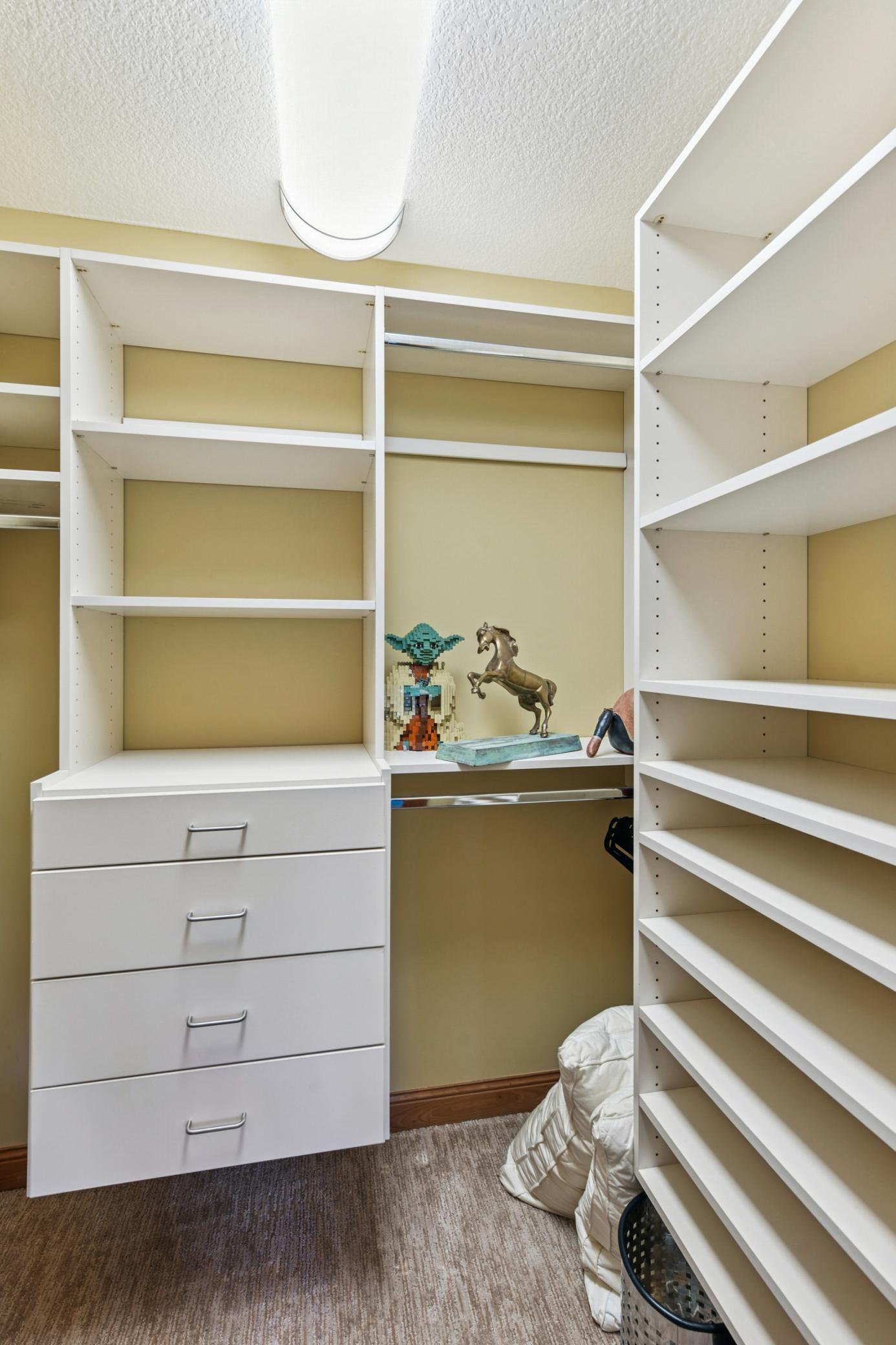 Custom closets in all the bedrooms offer exceptional storage and organization