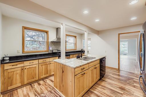 Look at all the cabinets and the two windows framing the range. Can you picture making Christmas cookies here?