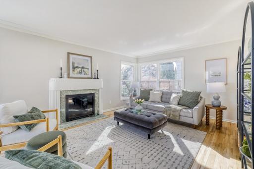 Corner windows on each end of the living room makes this light & bright year round. Entire home has new carpet, refinished HDWD floors and fresh painted to move right inpg
