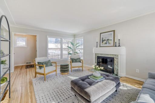 As soon as you enter this home you will find this cozy living room with HDWD flrs and a center FRPLCe04 Living Room.jpg