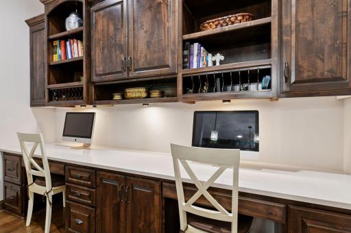The perfect homework nook, the pocket office features two built-in desks and ample cabinetry - alternatively, the desks and wall could be removed and the space could be opened into the Family Room for a more open floorplan.