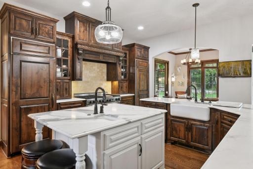 With keen attention to detail, every aspect of the Chef's Kitchen was chosen with care. Enjoy two large islands topped with marble and custom crafted cabinetry.