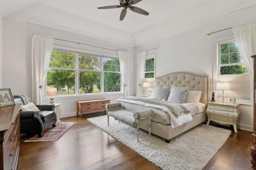 Tucked away on the main level is the Primary Suite - this tranquil retreat enjoys views of Lake Harrison.