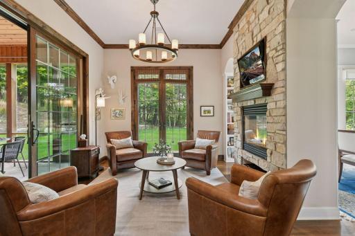 Step through to the Hearth Room - this space opens to the Kitchen expanding the entertaining space and offering a peaceful space to enjoy a glass of wine or sip your morning coffee.