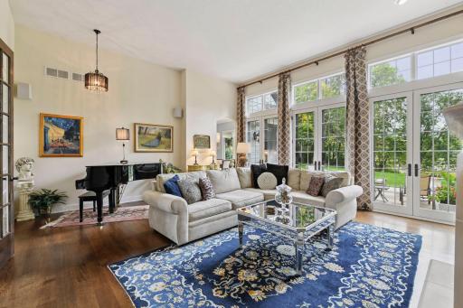 The main level features 12' ceilings and expansive windows that fill the home with natural light.