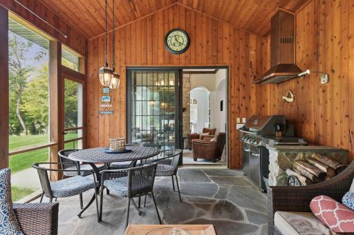 The space also features a gas grill with a plumed natural gas line and built-in exhaust hood.