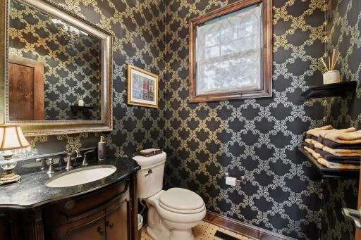 The Powder Room has been finished with luxurious details from the custom tiled flooring to the designer wall coverings.