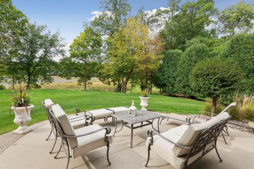 Connect with family and friends on the private patio while enjoying the backdrop of mature trees and lake views.