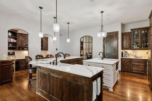 The large, open kitchen is beautifully finished with custom cabinetry and high-quality fixtures.