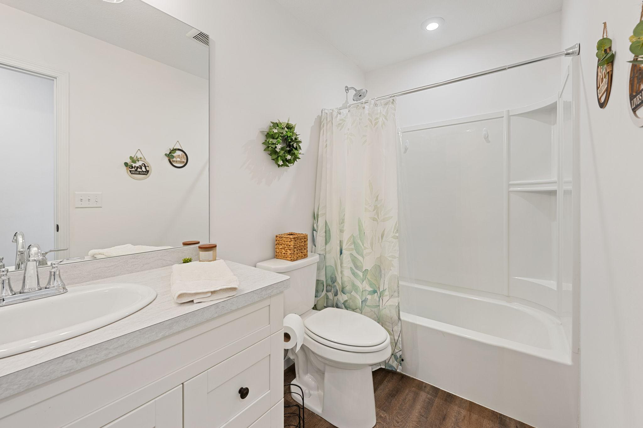 Beautiful main level full bathroom with oversized vanity.