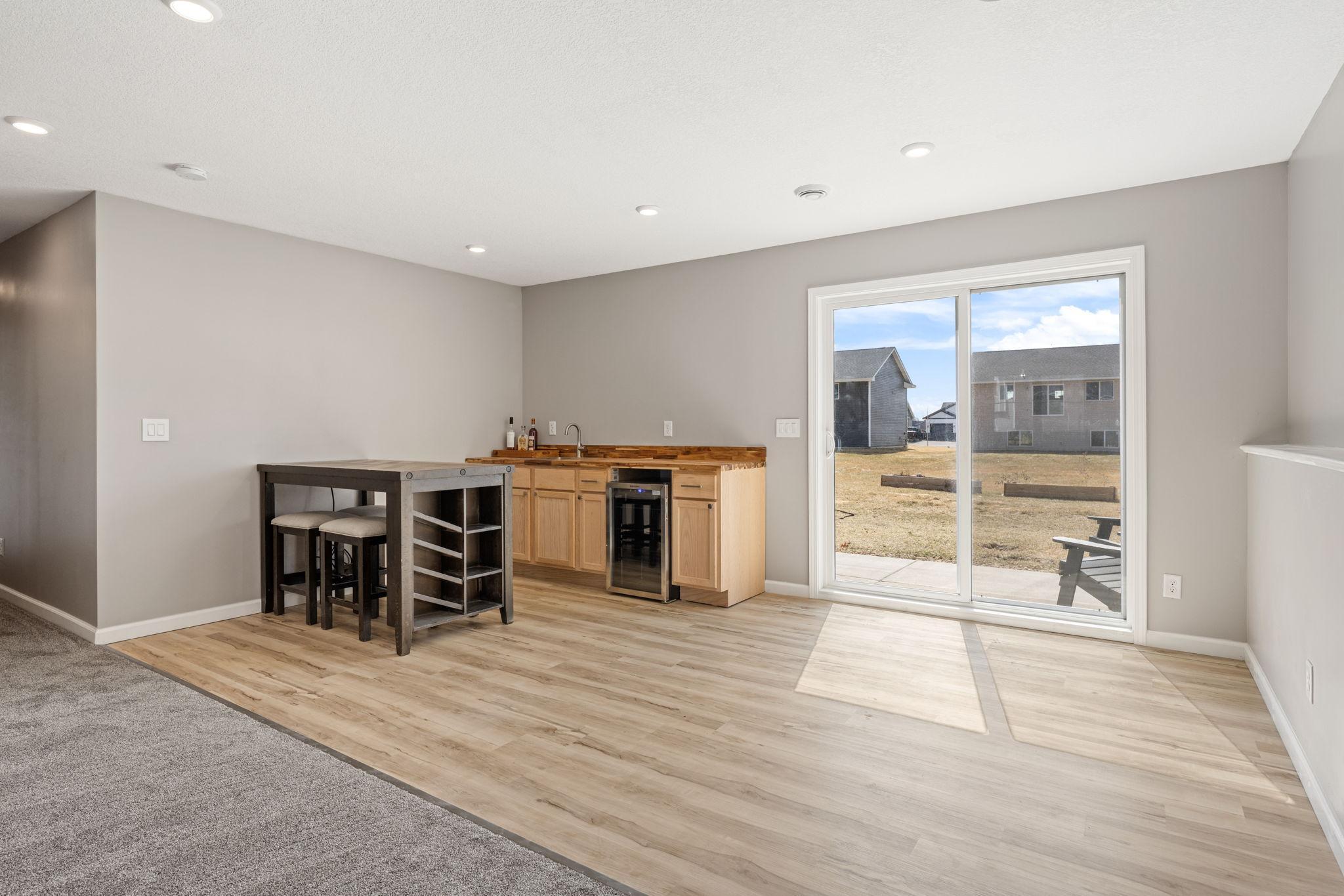 Wet bar with hot & cold water & ample storage for extra kitchen appliances when not in use.