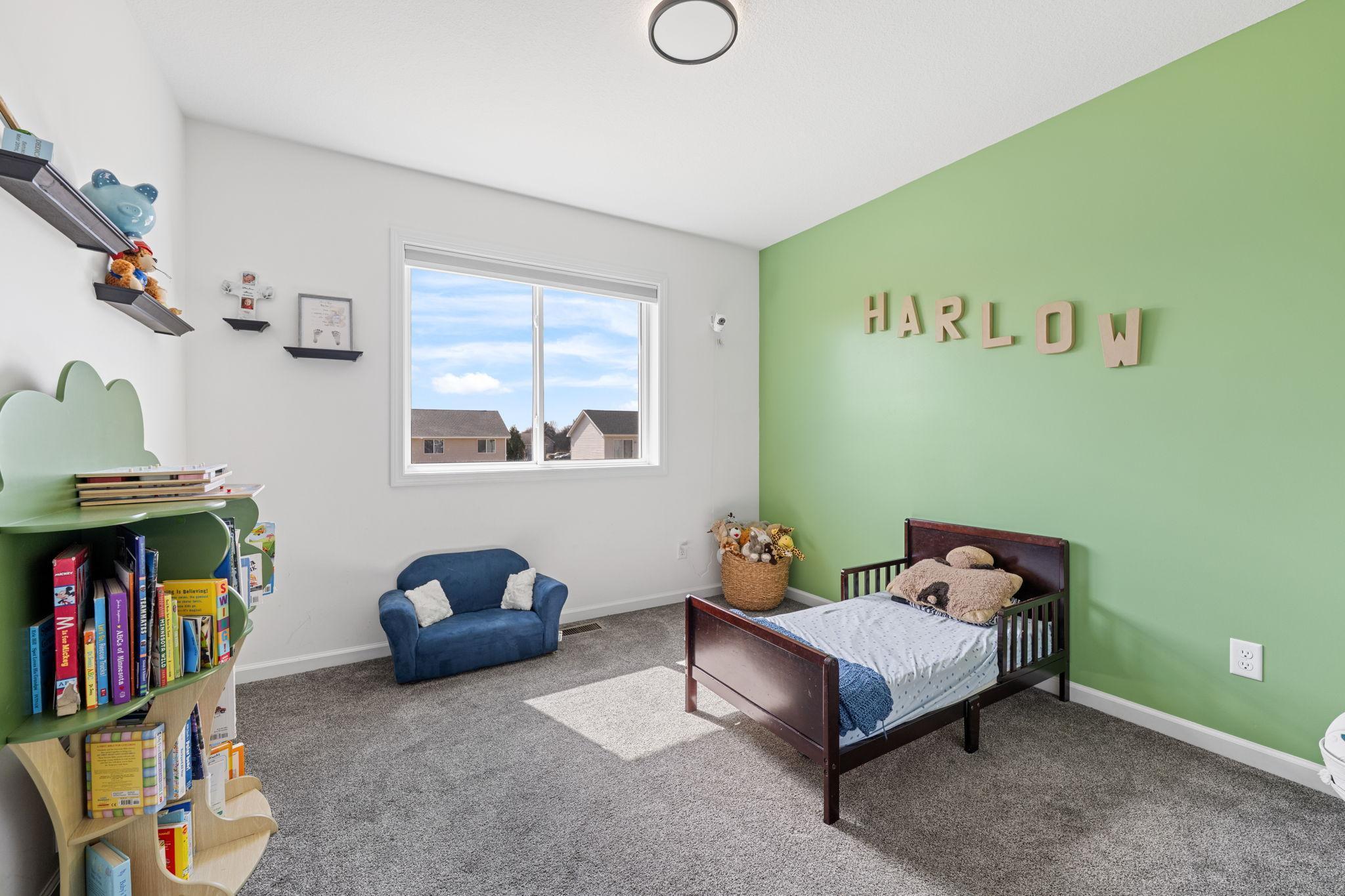 Three generously sized bedrooms and a full bath complete the main level.