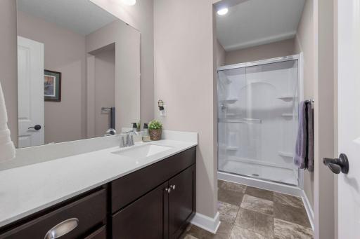 The bathroom is the lower level is located next to the 5th bedroom.