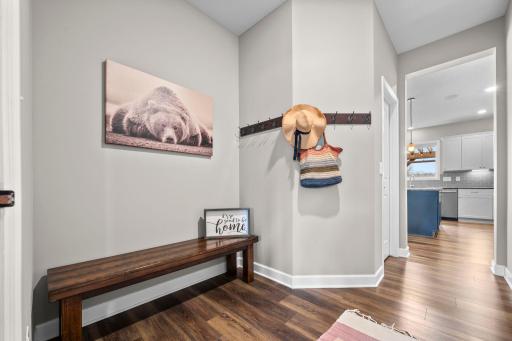 The entrance from the garage is large and welcoming and includes a closet for keeping the clutter contained.
