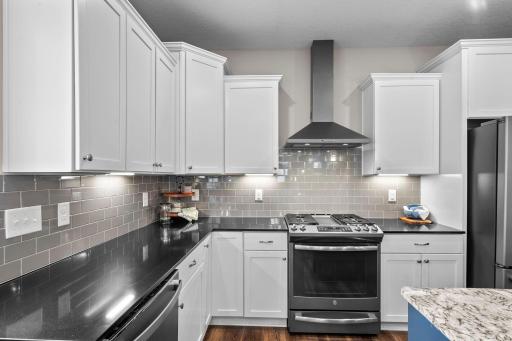 The tile backsplash is the perfect finishing touch for this kitchen!