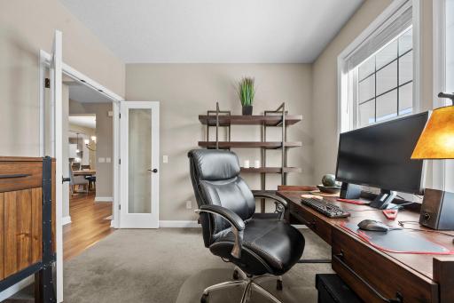 An office with french doors is conveniently located at the front of the home.